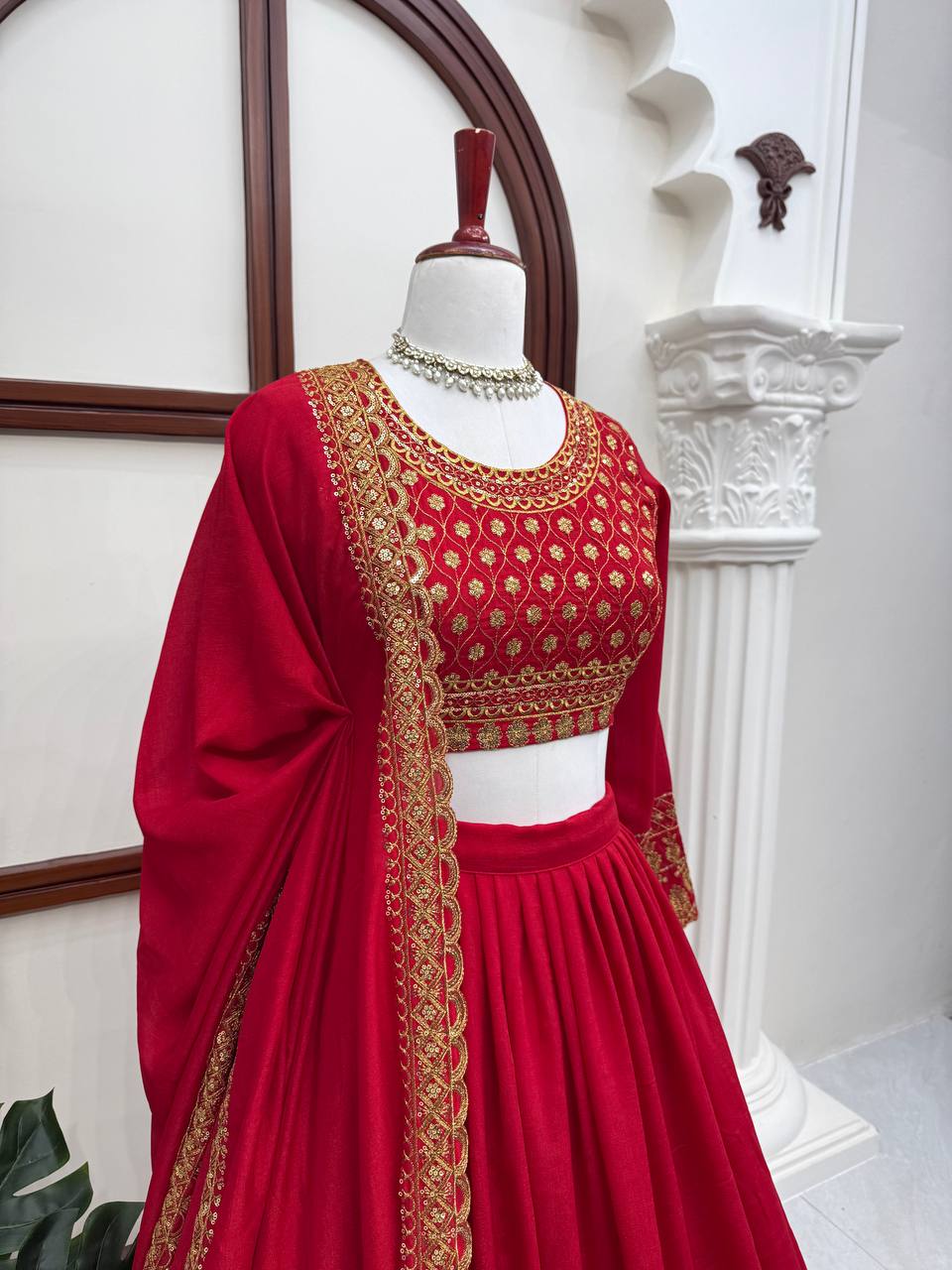 Classic Crimson Red Bridal Lehenga Choli Featuring Opulent Gold Zari Embroidery and Scalloped Borders